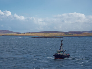 The Pilot Boat Knab facing a Vessel in Bressay sound that it has just escorted through the Northern Approach to Lerwick Harbour in the Shetlands. © Julian