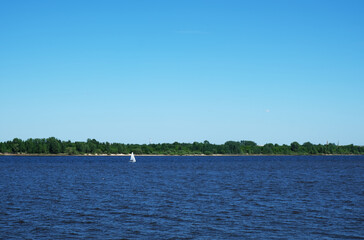 Clear day on the river with small boat
