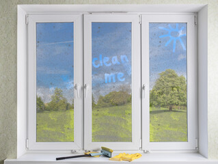 Cleaning modern PVC windows with a hand-held squeegee concept