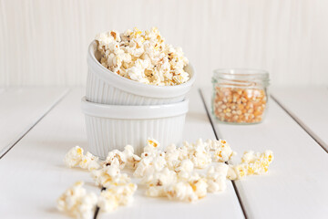 Popcorn and corn grains on a white background