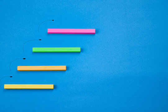 wooden blocks showing concept of steps up with colors - Powered by Adobe