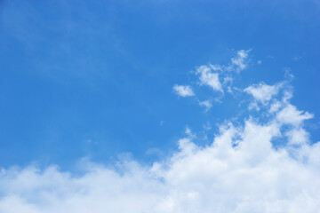 Blue sky background and white clouds soft focus, and copy space horizontal shape.