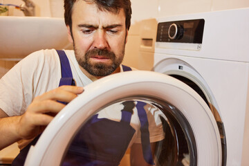 Plumber repairs broken clothes dryer