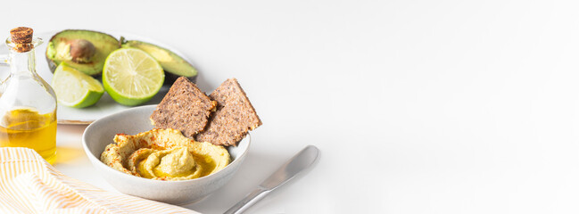 Chickpea hummus  bowl with olive oil, paprika and multigrain bread. Healthy snack large background for banner.