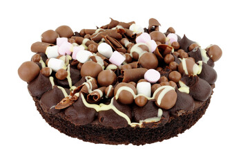 Chocolate rocky road dessert sponge cake decorated with chocolate balls and marshmallows isolated on a white background