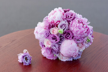 Lilac wedding bouquet of peonies and roses