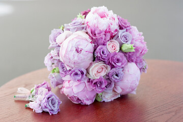 Lilac wedding bouquet of peonies and roses