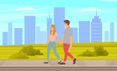 Fototapeta na wymiar Happy couple man and woman spend time together outdoor. People walking in city park, summer or spring, ctyscape. Couple walks by handle on road in park on background of high buildings and skyscrapers