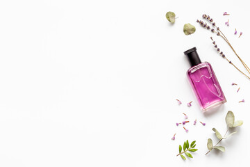 Perfume bottle with aroma flowers and leaves