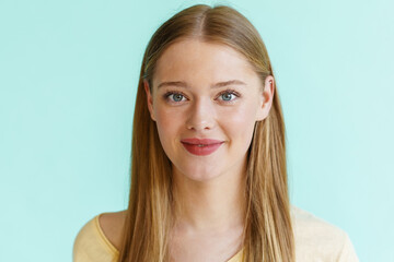 Young blonde white woman smiling and looking at camera