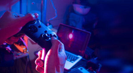 gamer playing game by joystick with computer, gaming and esports concept