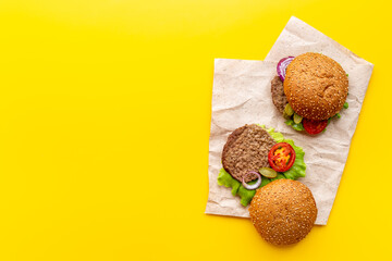 Homemade burgers with ingredients. Fastfood meal background