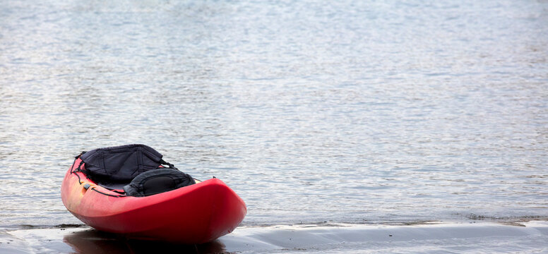 canoes on the beach at sunset, space for text