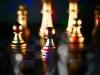 Closeup shot of metallic gold chess pieces