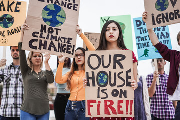 Group of demonstrators on road, young people from different culture and race fight for climate change - Focus on center girl face