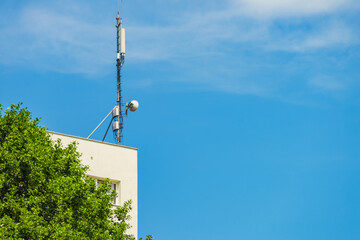 Cellular network antenna against blue sky.