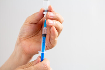 Injection of drugs into a syringe.