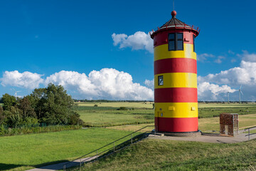 Pilsum lighthouse on the flood dam near Pilsum