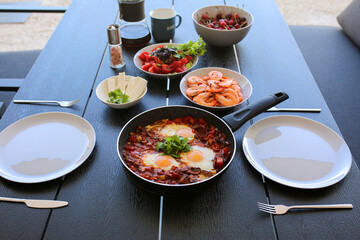 Food on the street in summer. Fried eggs with tamotami. Shrimp in summer.Coffee with eggs. Breakfast is served on the summer terrace. Shakshuka. Eat outside in summer. Summer breakfast at home. Dinner