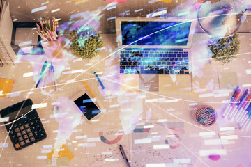 Double exposure of data drawing hologram over topview of study desk background with computer. Concept of Ai.