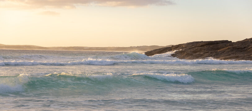 waves rolling on to rocky headland on the south coast