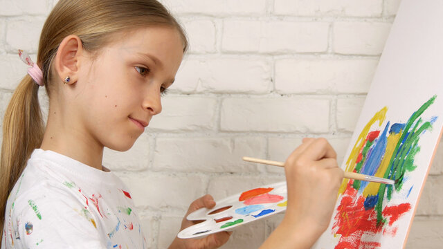 Child Painting on Easel, School Kid in Workshop Class, Young Girl Working Art Craft in Classroom