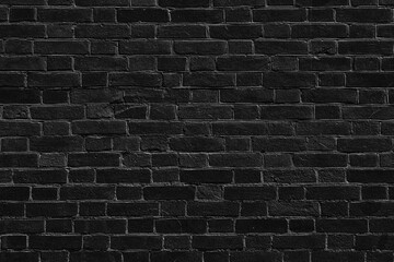 Black old rough brick wall texture. Shabby aged weathered dark gray brickwork. Abstract grunge background