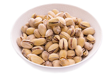 Nuts, from pistachios in a shell to a white plate on a white background. Isolated items and products