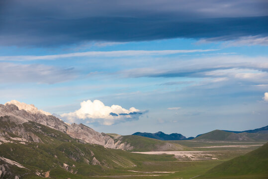 Natural landscape with dramatic sky over mountains