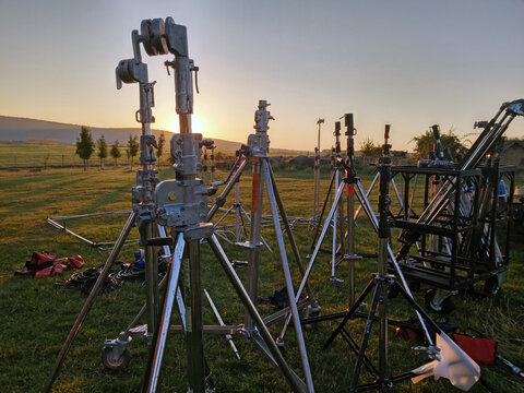 Lamp Stands, Tripods Unloaded By Film Crew For Filming, Movie Shooting In The Dawn Field In Hungary.