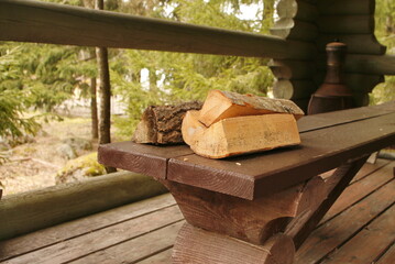 Fototapeta na wymiar logs lie on a wooden table. village life