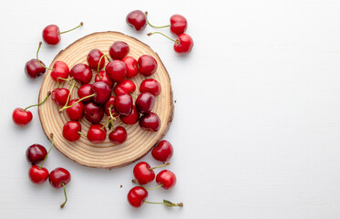 Sweet ripe cherries on white background. Top view.