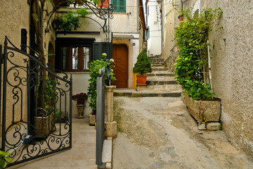 A small street between the old houses of Muro Lucano, a medieval village in the mountains of the Basilicata region in Italy