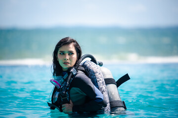 asian woman in scuba diving gear.