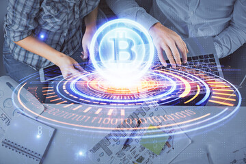 Double exposure of man and woman working together and crypto theme hologram drawing. Computer...