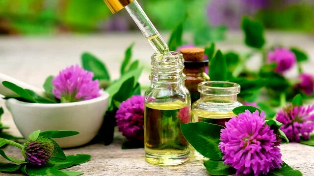 Clover extract in a small bottle. Selective focus.