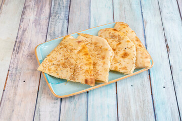 Indian naan cheese sliced bread with sesame seeds