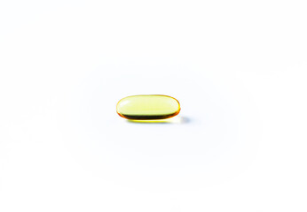 Fish oil capsules on white background and texture., Fish oil capsules and container., selective focus.