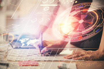 Double exposure of woman hands working on computer and data theme hologram drawing. Tech concept.