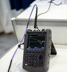 Handheld Signal Analyzer for Satellite Communication Testing © dizfoto1973