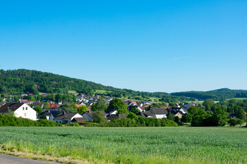 Obraz premium village in the mountains. Village in Hessen Germany. Green landscape.