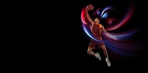 Fotobehang Flying. Beautiful african-american male basketball player in motion and action in neon light on black background. Concept of healthy lifestyle, professional sport, hobby. © master1305