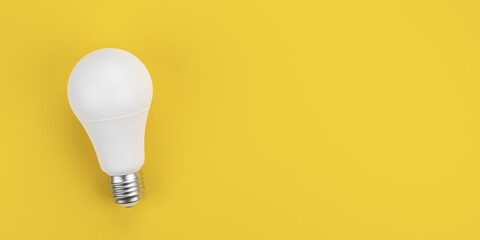 White LED light bulb on yellow background with copy space. Energy efficiency and creativity concept. 3D rendering.