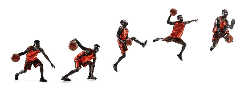 Full length portrait of a basketball player with a ball isolated on white studio background. advertising concept. Fit african athlete jumping with ball.