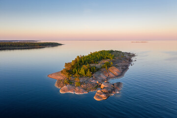 Obraz premium Beautiful rocky island at sunset. The Gulf of Finland. Aerial view.