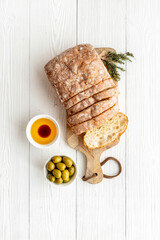 Olive oil on slice of bread with olives. Italian food appetizer