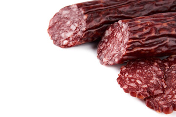 Salami smoked sausage piece isolated on white background. Salami, salami smoked sausage. Smoked meat. Meat products. Ingredients for the sandwich.