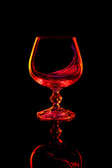 Red wine in glass isolated on black