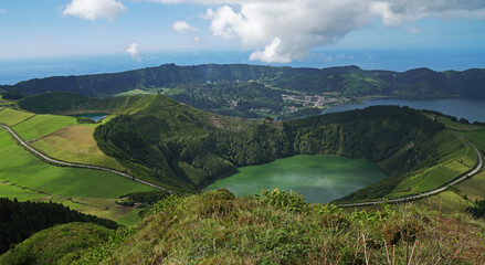 Magnificent landscape with a volcanic crater with grass. view of the mountains. Sete Cidades National Park, Porta Delgada, Azores © Georgios