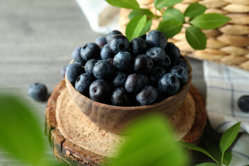 Fresh berry concept with blueberry on gray textured table